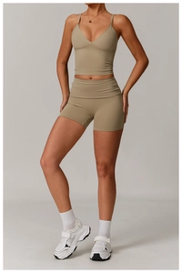 Detail of V-neck yoga sports bra and high waist shorts in matte khaki stretch fabric