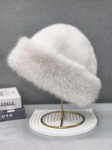 Detail view of the thick plush texture and soft grey faux fur on this winter bucket hat