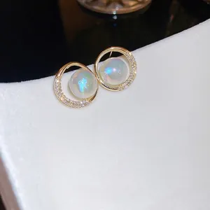 Chic gold plated earrings with aurora faux pearls and cubic zirconia in minimalist style
