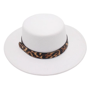 Detail of white wide brim boater hat featuring leopard print band and gold buckle accent