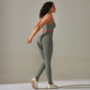 Seamless sage green yoga set featuring cross-back sports bra and high-waist leggings