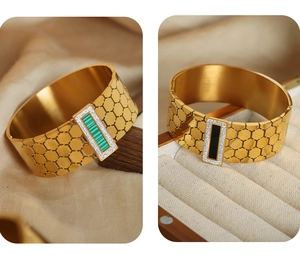 Detailed macro view of gold-plated honeycomb cuff bracelets with malachite and onyx stones