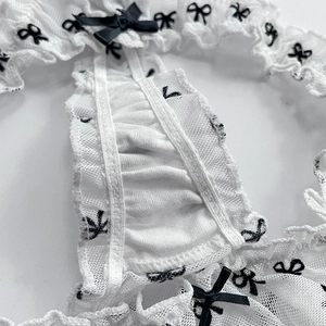 White lace thong with black bow print and satin ribbon decoration for women