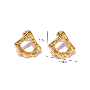 Detail shot of 18k gold plated geometric stud earrings with organic lava texture 2cm