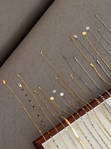 Detailed macro view of various 18k gold plated titanium steel chain styles and link textures