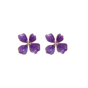 Purple flower stud earrings with white pearl centers and gold edges on white background
