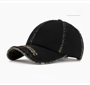 Close-up of black cotton baseball cap with leopard print details and gold embroidery