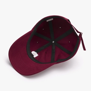 Inside view of burgundy cotton baseball cap showing internal structure and black sweatband