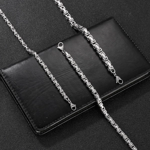Close-up of polished silver stainless steel Byzantine chain necklace with lobster clasp