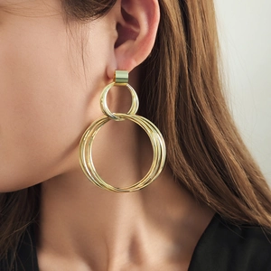 Chic multi-layered golden hoop earrings featuring a minimalist hollow circular metal design