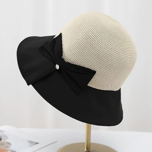 Chic beige straw sun hat with black wide fabric brim and elegant side bow decoration