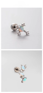 Detailed close-up of opal heart cross and leaf shaped titanium steel ear studs