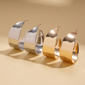 Polished metallic geometric C-shaped hoop earrings in gold and silver finishes