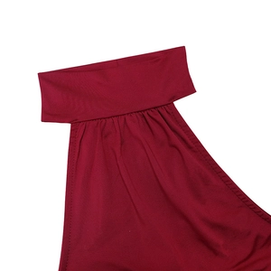 Detail of burgundy high neck dress showing delicate pleats and fabric texture