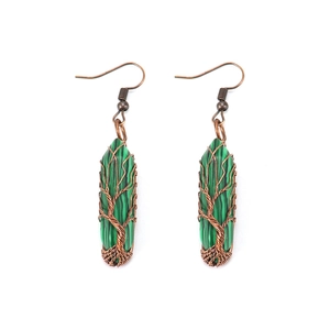 Macro detail of copper wire wrapped malachite earrings featuring the Tree of Life design