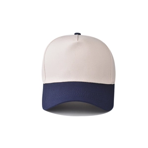 Detail of cotton leopard baseball cap showing beige crown and navy blue curved brim