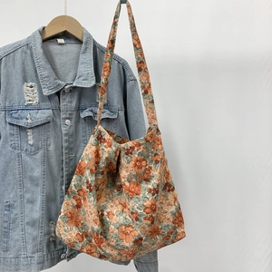 Close-up of floral print canvas tote bag showing large capacity and soft fabric texture