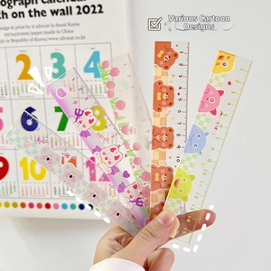Detail shot of five translucent 15cm plastic rulers featuring cute cartoon animal designs