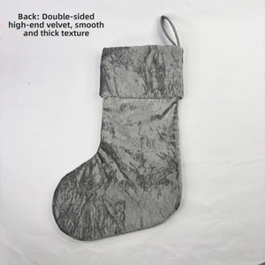 Close-up of premium gray velvet Christmas stocking with soft texture and hanging loop