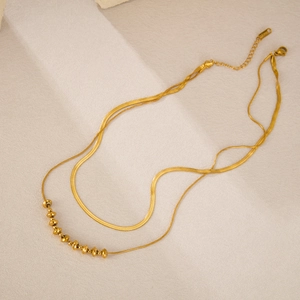 Elegant double-layered champagne gold titanium steel necklace with sleek snake and bead chain