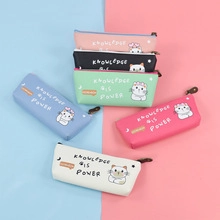 Row of colorful PU leather pencil cases with cartoon cat prints and slogans