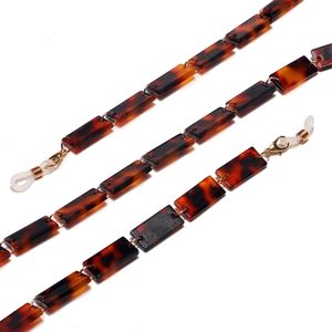 Chaîne de lunettes en acrylique léopard élégante avec anneaux dorés et boucles en gomme