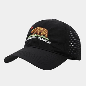 Detail of California Republic bear embroidery and laser-cut vents on black baseball cap