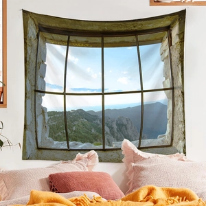 Detail of landscape wall tapestry showing mountains and forest through a stone window view
