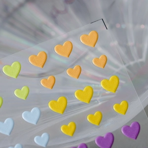 3D colorful heart nail stickers with metallic embossed texture on transparent backing