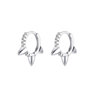 Detail view of silver chain tassel earrings featuring punk spikes and inlaid zircons