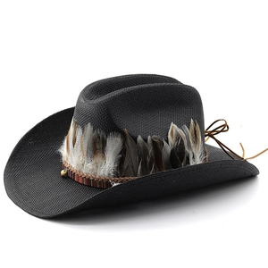 Black western cowboy straw hat with natural feathers and ethnic woven band on white background