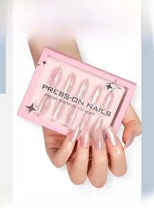 Detailed view of pearlescent pink cat-eye almond press-on nails in packaging