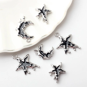 Set of black enamel star and moon pendants with silver alloy borders for DIY jewelry