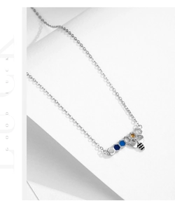 Detailed close-up of S925 silver bee necklace with colorful honeycomb enamel pendants
