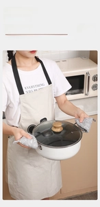 Detail of grey triangle pot lid handle covers with white floral pattern for heat protection