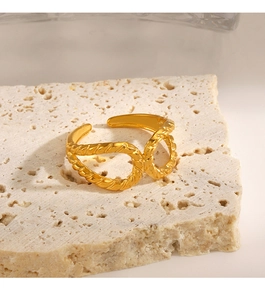 Detailed view of golden twisted rope ring on stone base showing double band design