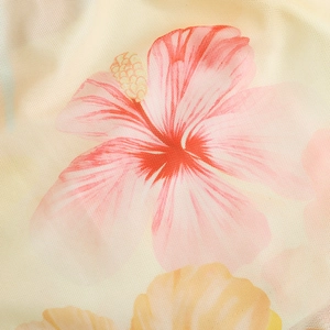 Detailed macro view of high-definition mesh fabric with vibrant tropical floral prints