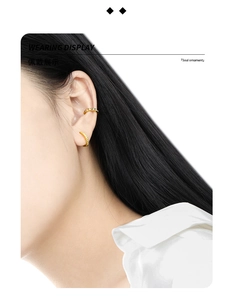 Macro view of gold S925 sterling silver geometric gear ear cuffs showing texture details
