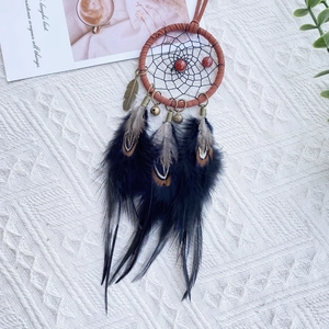 Ethnic dream catcher car pendant with brown hoop, black feathers, and vintage bells