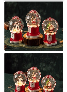 Three illuminated Christmas snow globes with Santa and snowman on gashapon bases