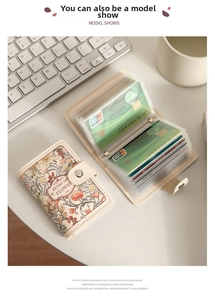 Detail view of floral accordion card holder with multi-layer slots and metal snap button