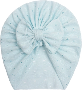 Close-up of light blue lace hollow pattern and bow detail on breathable baby turban hat