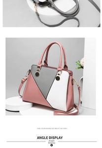 Detailed view of color-block PU leather tote with gold hardware and pink strap