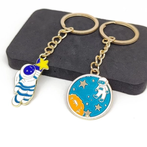 Cartoon astronaut and planet alloy keychain set with colorful enamel finish in gold plating