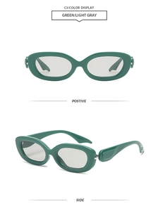 Detail view of retro oval sunglasses in dark green resin frame with light gray lenses