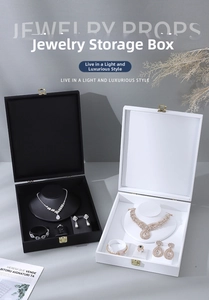 Detail view of premium black and white velvet jewelry organizers with gold metal locks