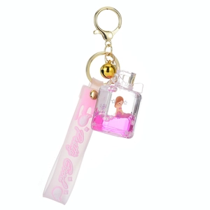 Kreativer Meerjungfrau Flüssigglitzer Parfümflasche Schlüsselanhänger mit rosa Band