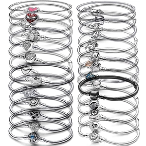 Silver plated snake chain bracelets with heart and cartoon character charms