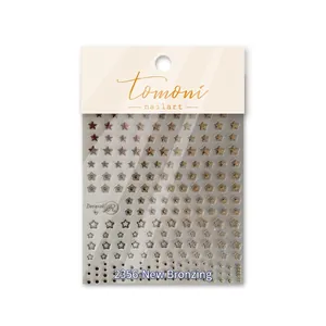 Golden and silver star nail art stickers with metallic finish on white background