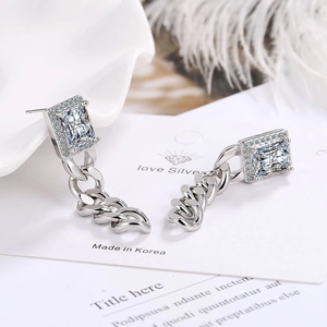 Silver chain drop earrings with rectangular zircon and small diamonds on white card